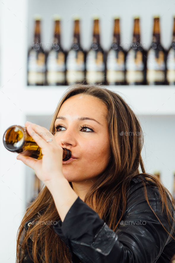 Woman drinking bottle beer Stock Photo by Click_and_Photo PhotoDune